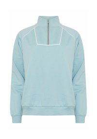 Felpa azzurra chiara a mezza zip con colletto alto, piping bianco a contrasto sui cuciture e vestibilità comoda. Tessuto morbido e texture.
