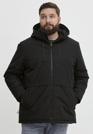 Black hooded jacket with a zip front, featuring a textured fabric, adjustable drawstrings, and two side pockets at the waist.
