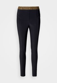 Leggings noirs avec une taille imprimée léopard, dotés de détails cousus et de deux poches avant. Texture lisse et design ajusté.