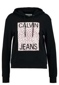 Sudadera negra con panel gráfico floral en el frente que presenta "CALVIN JEANS" en letras negras en negrita. Tiene capucha con cordones y puños acanalados.
