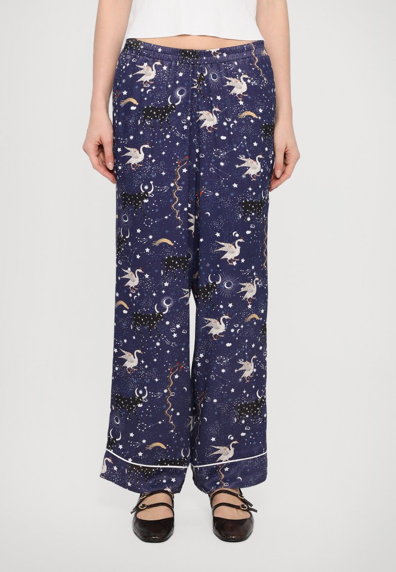 Blå pyjamabukser med et himmelsk mønster med enhjørninger, stjerner og måner; elastisk talje, vid benstil, med en kontrasterende kantdetalje.
