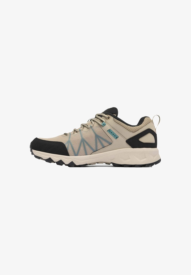 Scarpe da trekking beige con tomaia in rete, accenti neri e dettagli blu. Presentano una suola in gomma testurizzata e una linguetta sul tallone.