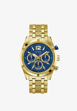 Kuldne randme kell sinise tekstureeritud diali, valgete ja kuldsete detailide, kolme kronograafi aladialiga ning kuldsest kootud metallist rihmaga.