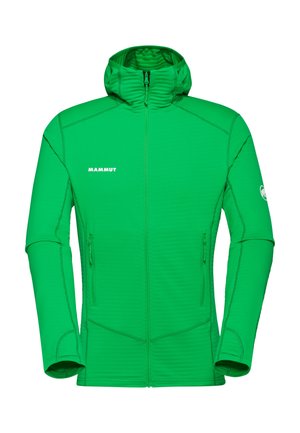 Zielona kurtka Mammut z kapturem na pełnym zamku, z dwoma przednimi kieszeniami na zamek i logo na piersi oraz lewym rękawie.