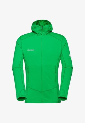 Zielona kurtka Mammut z kapturem na pełnym zamku, z dwoma przednimi kieszeniami na zamek i logo na piersi oraz lewym rękawie.