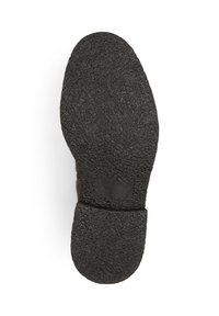 Zwarte rubberen schoenonderzijde met een licht verhoogde hak, voorzien van een glad, plat oppervlak en een ronde teenvorm.