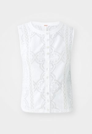 Blusa bianca senza maniche con dettagli in pizzo elaborati, chiusura a bottoni lungo la parte anteriore e scollatura arrotondata. Morbido tessuto di cotone.