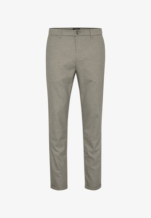 Heledad hallhallid, mis on valmistatud tekstuuriga kangast. Omab nööbi sulgemist, vöökohasid ja kitsenevaid jalgu puhta ääristusega.