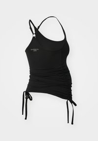 Top activo negro con tirantes finos, fruncido en los lados y lazos ajustables en el dobladillo. Fabricado con una tela suave y elástica.