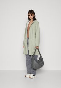 Rains CURVE JACKET UNISEX - Parkas - earth