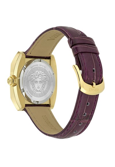 Auksinis nerūdijančio plieno laikrodis su purpuriniu odiniu dirželiu. Yra sidabrinis safyro stikliukas su Medūzos dizainu. Štuko užsegimas.