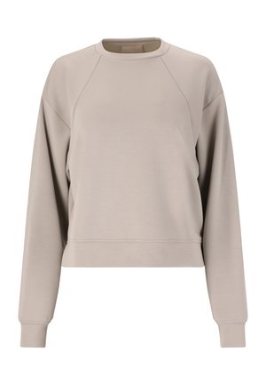 Helles beige, cropped Sweatshirt aus weichem Stoff. Mit Rundhalsausschnitt und langen Raglanärmeln mit gerippten Bündchen.