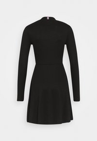 Vestito nero a coste con maniche lunghe, corpetto aderente, gonna svasata e scollo rotondo con dettaglio a righe sul retro.