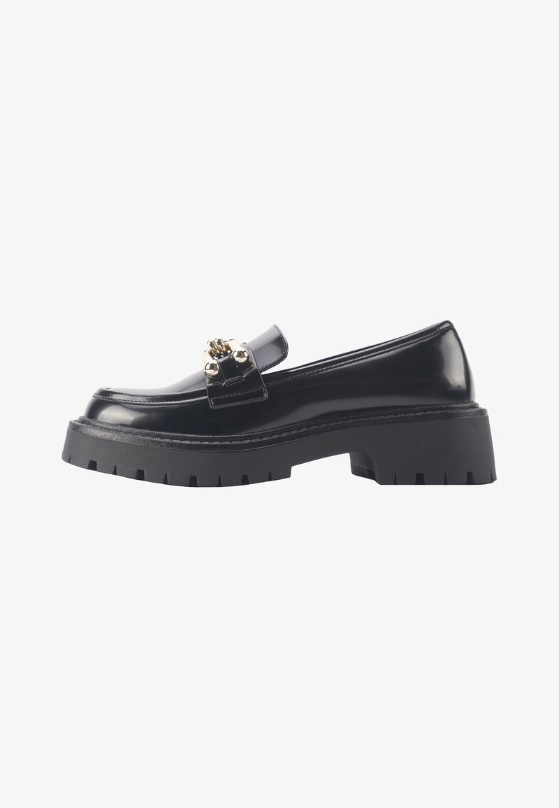 Black patent leather loafer with chunky rubber sole, gold-tone hardware detail, and smooth texture. Features a rounded toe design.