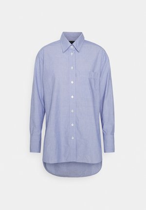 Camicia azzurro chiaro con bottoni, realizzata in cotone testurizzato, con maniche lunghe e tasca sul petto, con orlo curvo sul fondo.