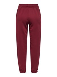 Pantalon de survêtement bordeaux avec taille et chevilles élastiques et poches latérales, conçu pour un usage décontracté ou sportif.