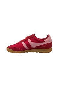 Red athletic shoes made of suede and mesh, featuring pink stripes, lace-up front, and a gum rubber sole with a textured grip.