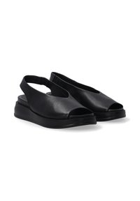 Schwarze Leder-Slingback-Sandalen mit offenen Zehen, einer glatten Textur und einer konturierten Keilsohle. Verfügen über ein minimalistisches Design und eine schlanke Silhouette.