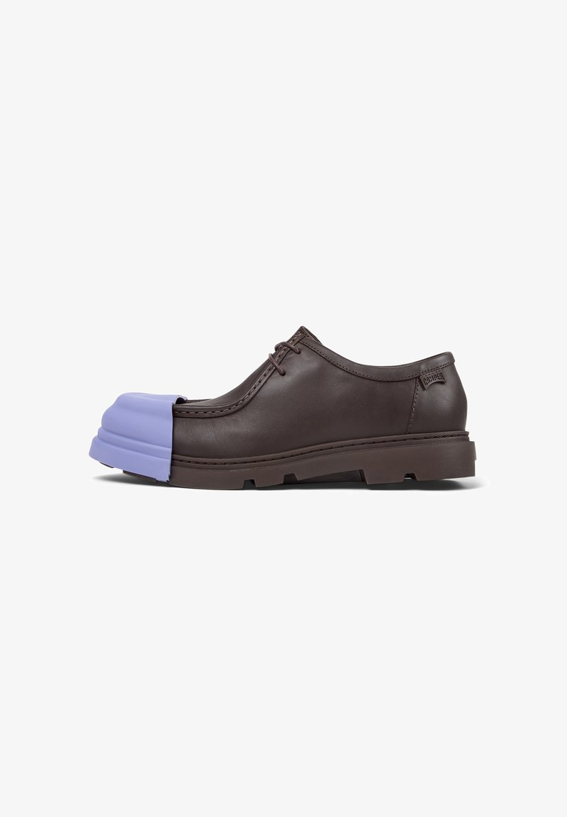 Brown leather shoe featuring a distinct purple rubber toe cap, showcasing a unique and modern design with a textured sole.