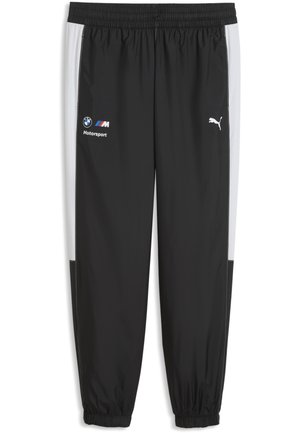 Schwarz-weiße Puma Trainingshose mit elastischem Bund und Bündchen, BMW Motorsport und Puma Logos auf den vorderen Oberschenkeln.