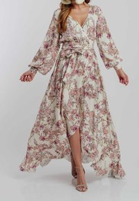 Blommig maxi-klänning i lätt tyg, med långa puffärm, djup V-ringning och midja med bälte. Färgerna inkluderar kräm, rosa och grön.