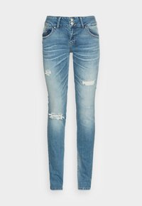 Jean skinny en denim bleu clair avec un effet délavé. Présente des zones usées et une fermeture à double bouton. Design classique à cinq poches.