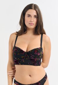 Schwarzer bestickter Bralette mit floralen Mustern in Lila und Gold, strukturiertem Design, verstellbaren Trägern und gewellten Kanten.