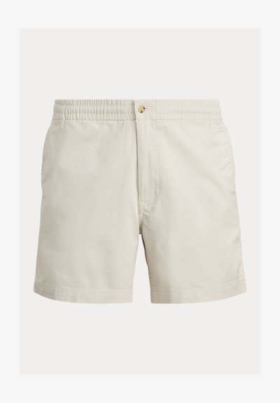 Beige bomullsshorts med resår i midjan, knappstängning och sidofickor. Mjuk textur med en enkel, klassisk design.