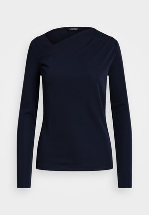 Navy long-sleeve top with an asymmetrical neckline, smooth texture, and fitted design. Simple stitching with no visible hardware or patterns.