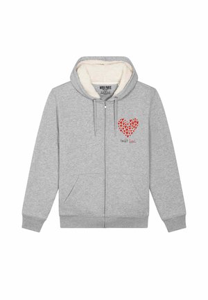 Grijze rits hoodie met fleece voering, voorzien van een rood hartpatroon op de linkerkant van de borst en twee voorzakken. Tekst leest "SWLT Heart."