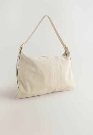 Beige ebay nahkaga õla kott ühe rihmaga ja kuldse tooni detailidega. Omab sujuvat tekstuuri ja ristküliku kuju.