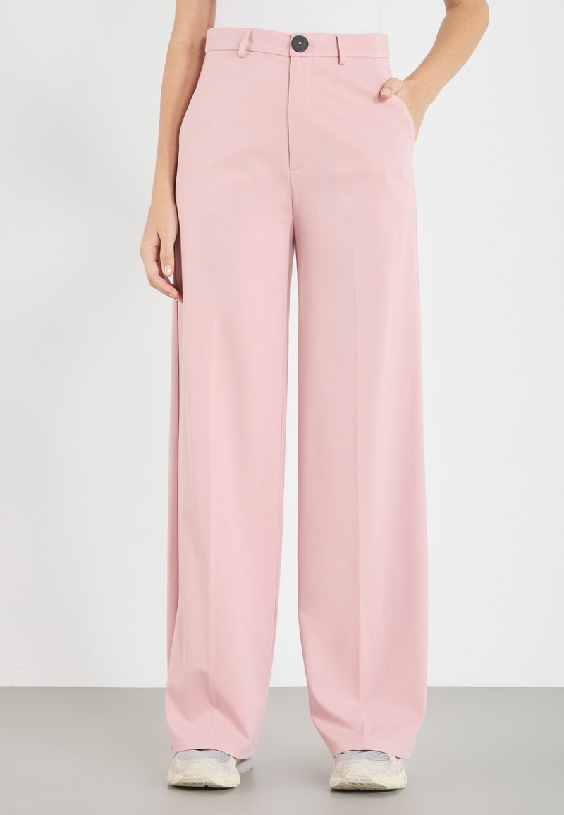 Light pink wide-leg trousers made of smooth fabric, featuring a button closure, belt loops, and side pockets.