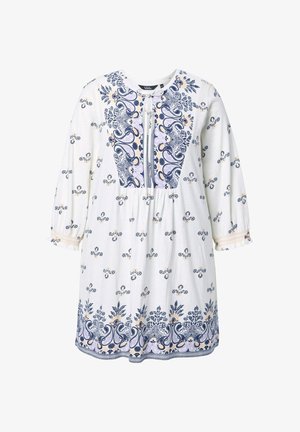 Valkoinen pitkähihainen mekko, jossa sinisiä ja beigejä kukka- ja paisley-kuvioita, pyöreä pääntie ja edessä solmittava yksityiskohta.