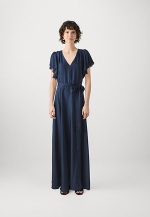 Long navy blue dress with a V-neck, short ruffled sleeves, and a tie belt at the waist. Smooth, shiny fabric with a flowing silhouette.