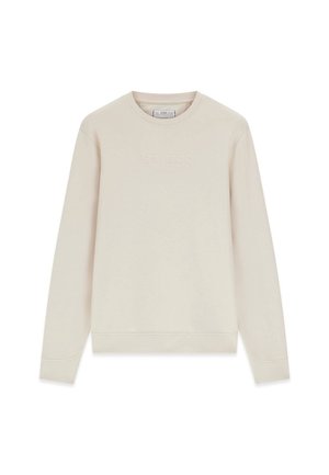 Lichtbeige crewneck-trui met lange mouwen en tonale "GUESS"-logo in reliëf op de borst.