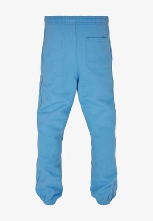 Lyseblå sweatpants lavet af blødt bomuldsstof. Har en elastisk talje, tapered benmanchetter og en baglomme.