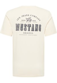 Beige cotton t-shirt with short sleeves. Front features navy blue graphic print of "MUSTANG" and associated text. Classic round neckline.