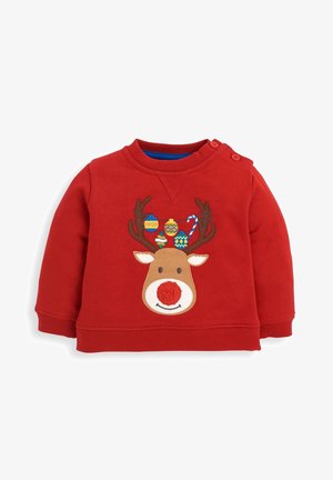 Czerwona bluza dla małego dziecka z uśmiechniętą twarzą renifera i porożem ozdobionym kolorowymi ozdobami świątecznymi oraz laski cukrowej.