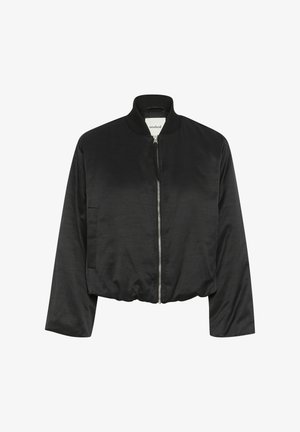 Must mustrakk, millel on lukuga esiosa, soonikkoelus ja elastne äär. Valmistatud siledast kangast, küljetaskudega ja mugava lõikega.