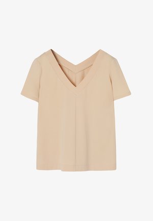 Short-sleeve top in soft beige fabric, featuring a deep V-neck design, straight cut, and clean stitching along the edges.
