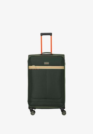 Dark green soft suitcase with four black wheels, beige horizontal zip pocket, and extended orange telescopic handle.