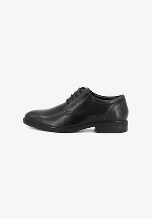 Scarpa formale oxford da uomo in pelle nera con chiusura con lacci e tacco basso impilato, mostrata in profilo laterale su sfondo bianco.