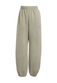 Svijetlo bež trenirke izrađene od mekanog materijala. Imaju elastičnu waistband, sužene gležnjeve i minimalistički dizajn s malim logotipom.