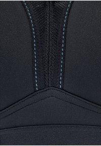 Top sportivo nero con zip frontale, tessuto a trama, cuciture blu a contrasto e design strutturato e aderente per un supporto ottimale.