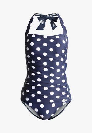 Marineblauer Einteiler-Badeanzug mit weißen Punkten, gerüscht, mit Halterneck-Bindung und moderater Bedeckung, aus dehnbarem Stoff gefertigt.