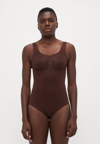 Brown one-piece swimsuit featuring a scoop neckline, thick straps, and seamless design. Made from smooth, stretch fabric for comfort.