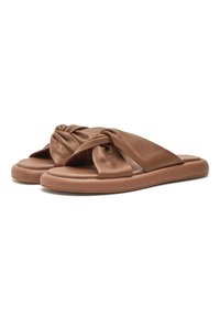 Brown leather sandals with a knotted strap design, flat sole, and cushioned footbed, featuring a smooth texture and minimalistic style.