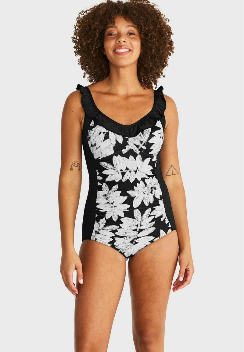 Svart baddräkt med vitt blommönster och volangkrage. Har sidopaneler för en figurnära passform, slät textur och justerbara remmar.