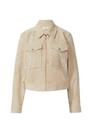 Beige Cordjacke mit Reißverschluss, zwei Brusttaschen und einem leicht cropped Design. Der Stoff hat eine weiche, strukturierte Oberfläche.