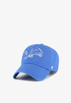 Blue baseball cap with embroidered leaping lion logo on front and small white '47' logo on side, angled to right.